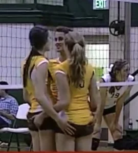 Teen volleyball girls touching each other’s booties