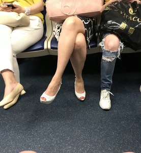 Hot milf's crossed legs in a subway train and at the station creepshots