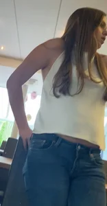 Hot teen shows off wearing bare backed top