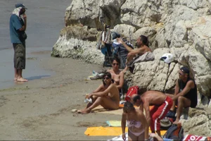 Girls on a nude beach in Sitges, Spain
