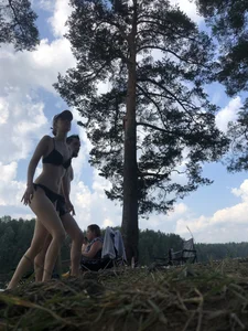 Skinny and Tall Girl in Swimsuit Walking in a Wood