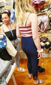 Blonde in leggings in a lingerie shop creepshot