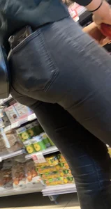 Sexy butt in tight grey jeans with a phone in her back pocket grocery store creepshot