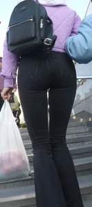 Juicy ass in black tight jeans and nice skinny legs street closeups