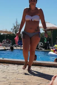 Sexy British girl in a bikini at the pool with camel toe