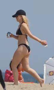 Two thick white girls in bikinis on the beach with big asses
