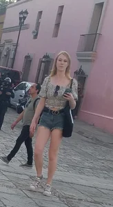 Blonde in short shorts, legs and a peach in sight