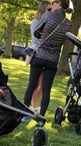 Sexy fit milf in black leggings at the park