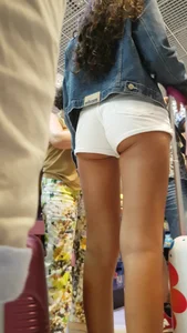 Tanned teen with cheeks hanging out of shorts (Hubba Bubba)