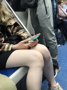 Very cute candid girl with very pale skin sitting in a subway train creepshots