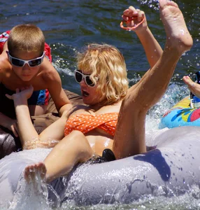 Sexy party girls in bikinis on a lake