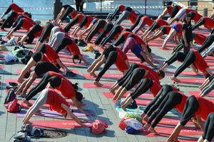 Large Group of Girls in Tights Doing Yoga