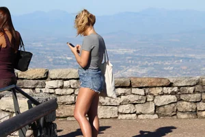 Sexy tourist in short jean shorts showing cheeks