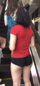 Skinny candid booty in spandex mini shorts, girl on an escalator creepshot
