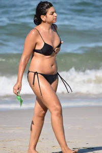 Thick mature brunette bikini lady on the beach with a nice body