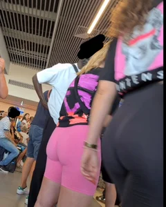 Hot airport girl wearing pink tight short