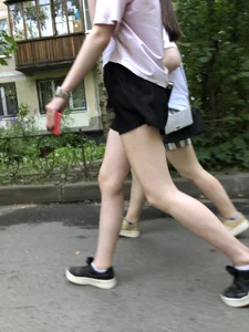 Couple of candid teens walking down the street