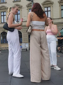 Long blonde braless in a white outfit (many pictures)