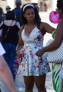 Black girl showing major cleavage in dress and almost upskirted