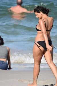 Thick mature brunette bikini lady on the beach with a nice body