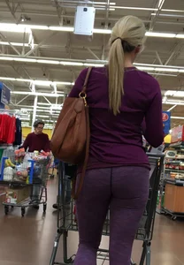 Sexy blonde shopping at Walmart in purple leggings with some vpl