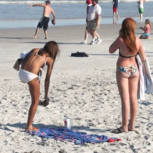 Two cute teens in bikinis