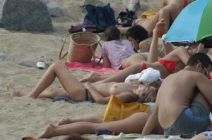 Topless girls on a beach in Barcelona
