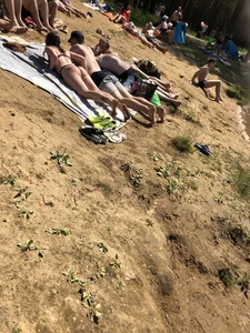 Hot Candid Girls Lying on the Beach in Swimsuits Gallery