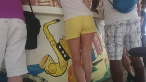 Milf in yellow shorts with vpl and a wedgie