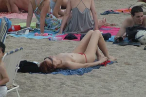Topless girls on a beach in Barcelona