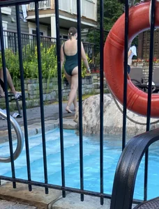 Candid Girl in a One-Piece Swimsuit by the Pool Creepshots