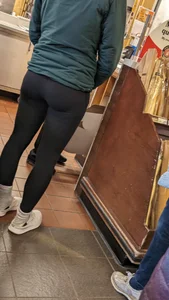 Tight legs and ass in black legging. Bend over