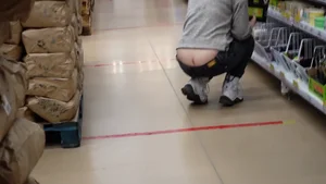 Squatting girl flashing her butt crack at the supermarket video