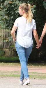 Blonde chick walking with her boyfriend in tight jeans