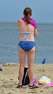 Blue bikini beach girl undressing with a decent ass
