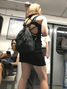 Candid girl in a short dress with muscly legs subway train creepshot
