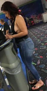 Thick brunette in tight jeans and showing some side boob