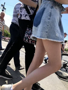 Teen Candid Girl in a Denim Skirt And Sneakers With Thin Legs on a Crosswalk Creepshots