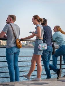 Hot candid chick wearing a top and a denim fringed skirt street creepshot, hot legs