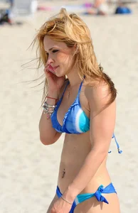 Sexy ass redhead with a great body in blue semi thong bikini