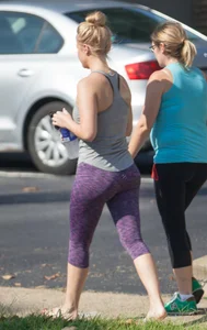 Sexy blonde out walking in purple leggings with a nice ass