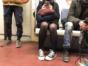 Cute masked candid girl wearing a skirt and black pantyhose, subway train creepshots