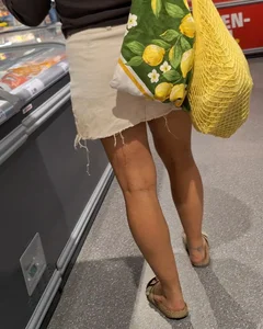 Curly haired woman with huge tits and nice legs