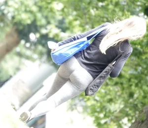 Tight bum walking through the park