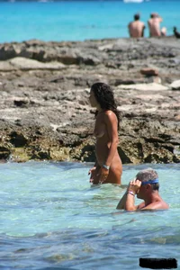 Nude beach ladies in the water showing their tits