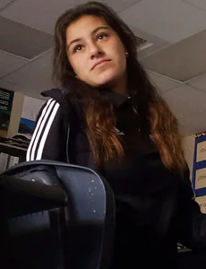 College girl revealing tiny thong while bending over in classroom