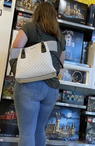 Thick brunette filling out jeans at Lego Store