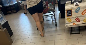 Milf in black biker shorts and flip flops