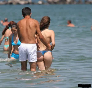 A bunch of sexy beach voyeur babes in bikinis, thongs and topless