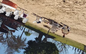 Blonde beach girl with a great ass in pink thong bikini